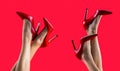 High heel shoes. Beautiful legs woman. Pretty female legs with red high heels on red background. Perfect female legs Royalty Free Stock Photo