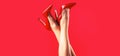 High heel shoes. Beautiful legs woman. Pretty female legs with red high heels on red background. Perfect female legs Royalty Free Stock Photo