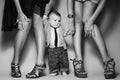 High heels family concept. Stylish baby boy standing with his fashionable mother and aunt. Girls in stylish peep toes shoes. Royalty Free Stock Photo