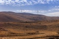 High hill landscape with wind turbines