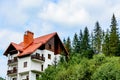 High house in the woods with a red roof Royalty Free Stock Photo