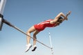 High Jumper In Midair Over Bar