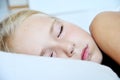 High key Close up portrait of cute little girl sleeping. Royalty Free Stock Photo