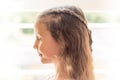 High-key portrait of girl with braided hair