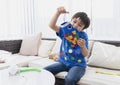 High key Portrait happy kid stay at home making coloufull Koinobori Carp streamers, Child boy doing Japanese fish kite in sunny Royalty Free Stock Photo