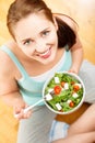 High key Portrait young caucasian woman eating Salad at home Royalty Free Stock Photo