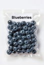 Vacuum packed blueberries clustered inside a clear plastic pouch on a bright white high key studio background Royalty Free Stock Photo