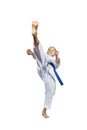 High kick mae-geri athlete beating with a blue belt