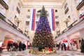 High and large Christmas tree in the Mall Children`s world. Mosc