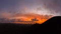 High level aerial view of the dramatic sunset over the volcanic mountains near Corralejo Royalty Free Stock Photo