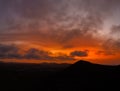 High level aerial view of the dramatic sunset over the volcanic mountains near Corralejo Royalty Free Stock Photo