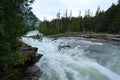 Torrential McDonald Creek in Glacier National Park, Montana after heavy rains. Royalty Free Stock Photo