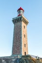 High lighthouse on a rock located on a French island. Royalty Free Stock Photo