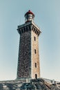High lighthouse on a rock located on a French island. Royalty Free Stock Photo