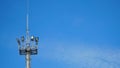 High lighting mast against the blue sky. View from below. Full height. Royalty Free Stock Photo