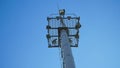 High lighting mast against the blue sky. View from below. Full height Royalty Free Stock Photo