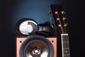 High loudspeaker tower with acoustic guitar Royalty Free Stock Photo