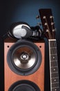 High loudspeaker tower with acoustic guitar Royalty Free Stock Photo