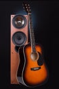 High loudspeaker tower with acoustic guitar Royalty Free Stock Photo