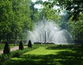 Petergof, Saint peterburg, Russia - JUNE 12, 2013: High round lush white fountain in the park of Petergof. Royalty Free Stock Photo