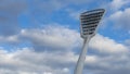 High mast on a background of a cloudy sky. Light pole under the blue sky. Space for text. Light pole tower with blue sky Royalty Free Stock Photo