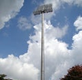 High mast of spot light with cloud on blue sky background. Royalty Free Stock Photo