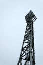 High metal stadium light against dark day sky.Vertical image Royalty Free Stock Photo