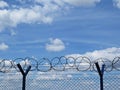 High Metallic Protection Perimeter Fence Railing with Barbed Wire on Top Royalty Free Stock Photo
