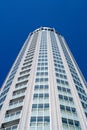 High modern building on background blue sky.