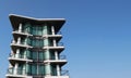 High modern, luxury apartment building with blue sky at background