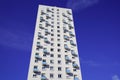 High modern white facade building over blue sky with balcony in city Royalty Free Stock Photo