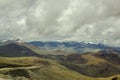 A high mountain desert valley with snow ridges of mountains