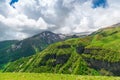 High mountain ranges of the Caucasus in June, snow on the peaks on a sunny warm day. Landscapes