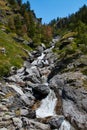 High mountain stream flowing between the rocks Royalty Free Stock Photo