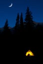 High Mountain Wilderness Backpacking Camping in Tent Glowing with Latern Light