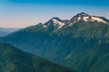 High mountains with green slopes and snowy peaks. Mount Chugush, height 3238 m, mountain peak in the western part of the Greater Royalty Free Stock Photo
