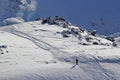 High mountains off-piste slopes for freeride with traces of skis and snowboards, sunny winter day, Caucasus Mountains, Elbrus Royalty Free Stock Photo