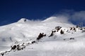 High mountains off-piste slopes for freeride with traces of skis and snowboards, sunny winter day, Caucasus Mountains, Elbrus Royalty Free Stock Photo