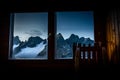 High mountains peaks range dusk evening through window view