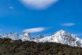 High mountains with snow on top in the winter, beautiful skies and clouds. The grass is yellow in Mount Cook Rd Royalty Free Stock Photo