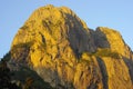 High mountains in the sunny rays in sunrise as a gold Royalty Free Stock Photo