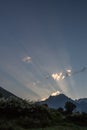 Early morning sunlight beams over Himalayas in Jispa, India