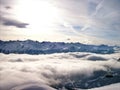 High in the mountains a view above the clouds, with a little bit sun Royalty Free Stock Photo
