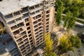 High multi storey residential apartment building under construction. Concrete and brick framing of high rise housing. Real estate Royalty Free Stock Photo