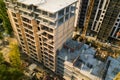 High multi storey residential apartment building under construction. Concrete and brick framing of high rise housing. Real estate Royalty Free Stock Photo