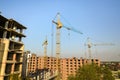 High multi storey residential apartment buildings under construction. Concrete and brick framing of high rise housing. Real estate Royalty Free Stock Photo