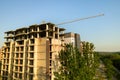 High multi storey residential apartment buildings under construction. Concrete and brick framing of high rise housing. Real estate Royalty Free Stock Photo