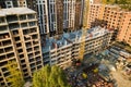 High multi storey residential apartment buildings under construction. Concrete and brick framing of high rise housing. Real estate Royalty Free Stock Photo