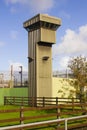 A high observation tower at the corner of a modern prison at Magilligan point in County Londonderry in Northern Ireland