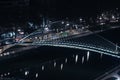 High perspective long exposure view of Zubizuri bridge at night in Bilbao, Spain